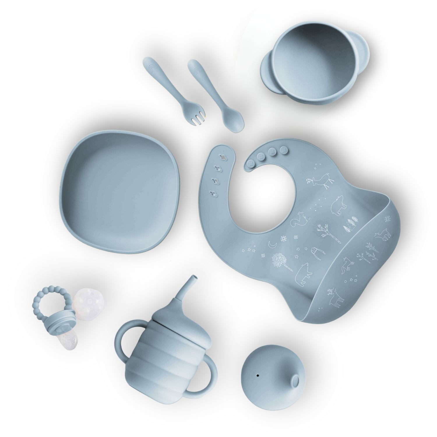 Collection of baby utensils including a bowl, spoon, fork, bib, and cup on a white background.